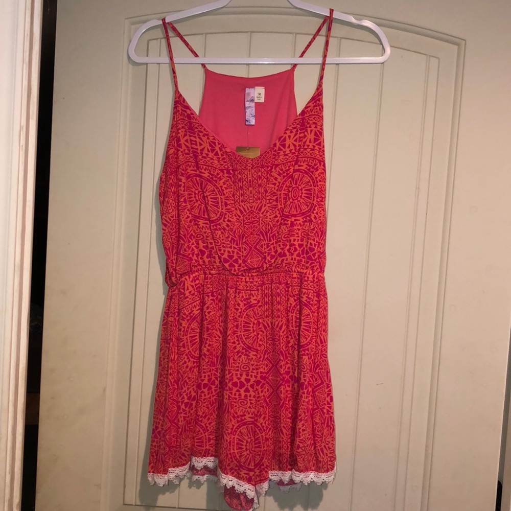 Brand new Francesca’s pink and orange romper